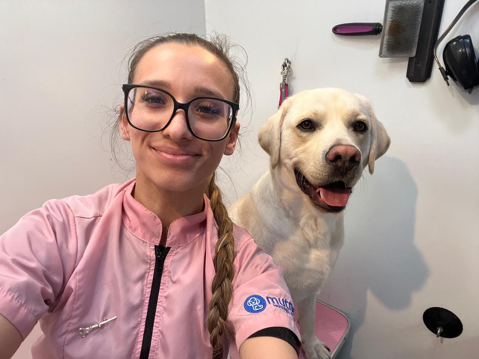 Kelly from Bark & Bliss with a happy Labrador