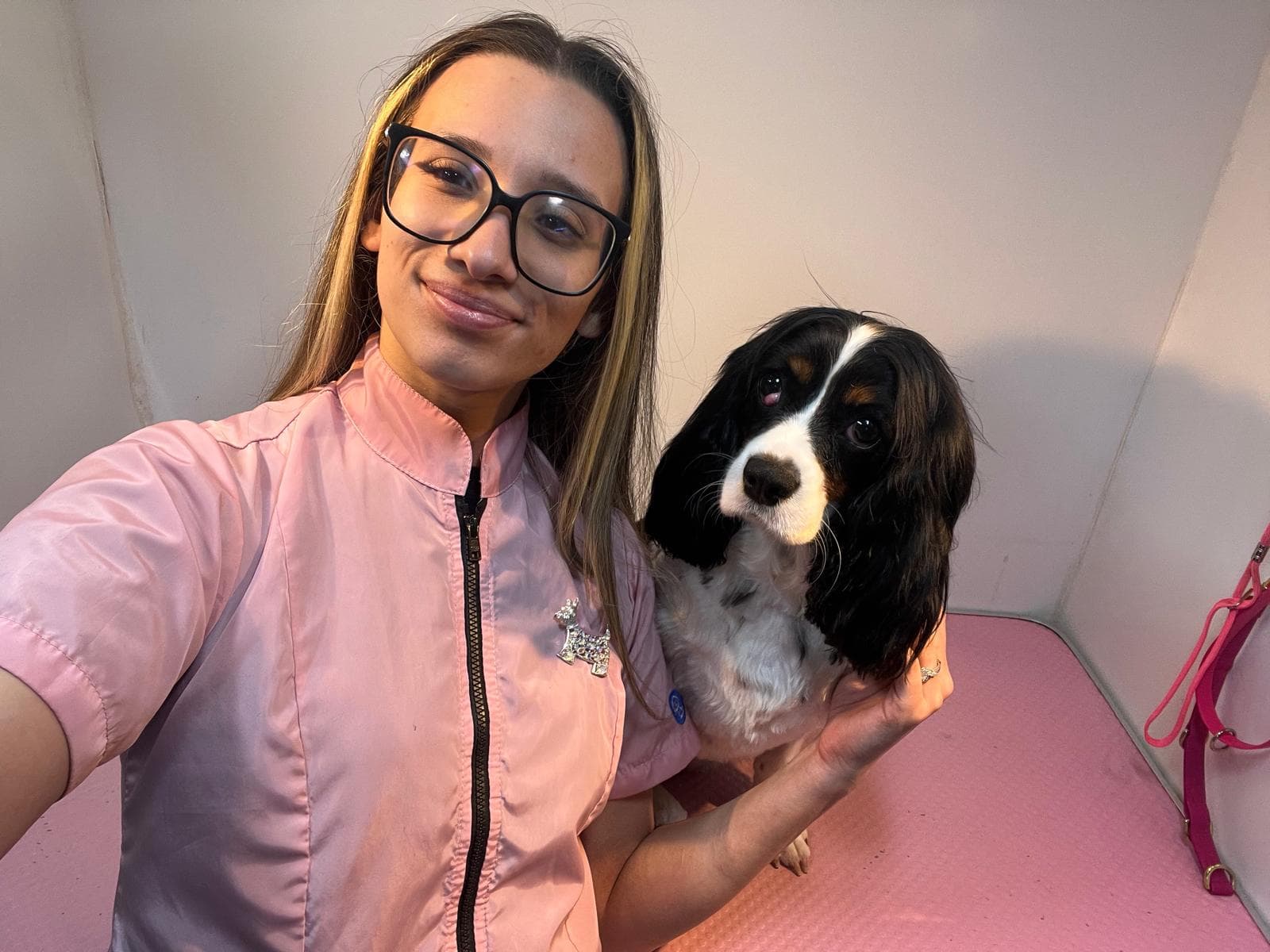 Kelly with a happy dog inside the Bark & Bliss mobile van